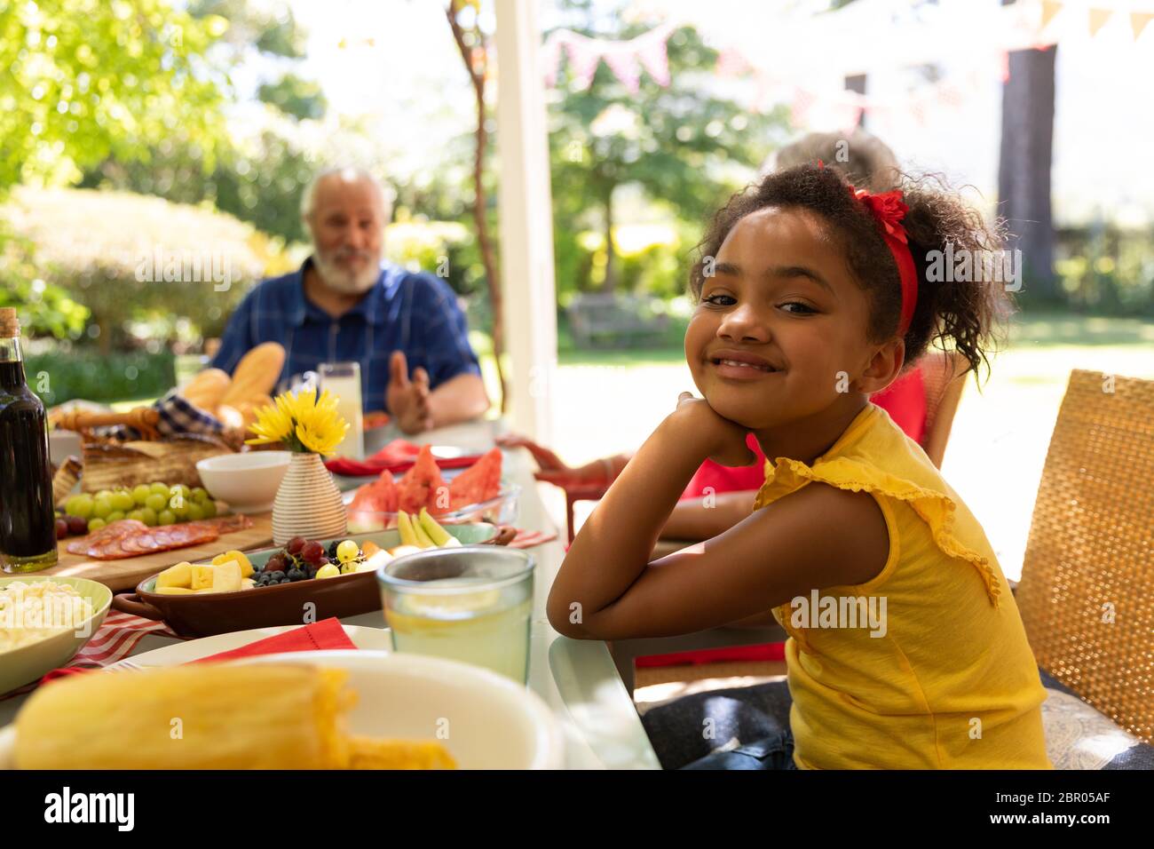Little girl looking at camera and smiling Stock Photo