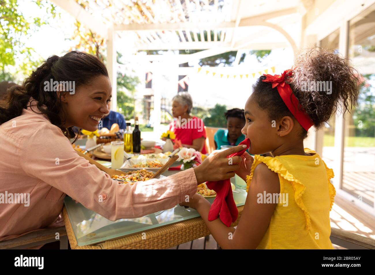 Family eating together at table Stock Photo