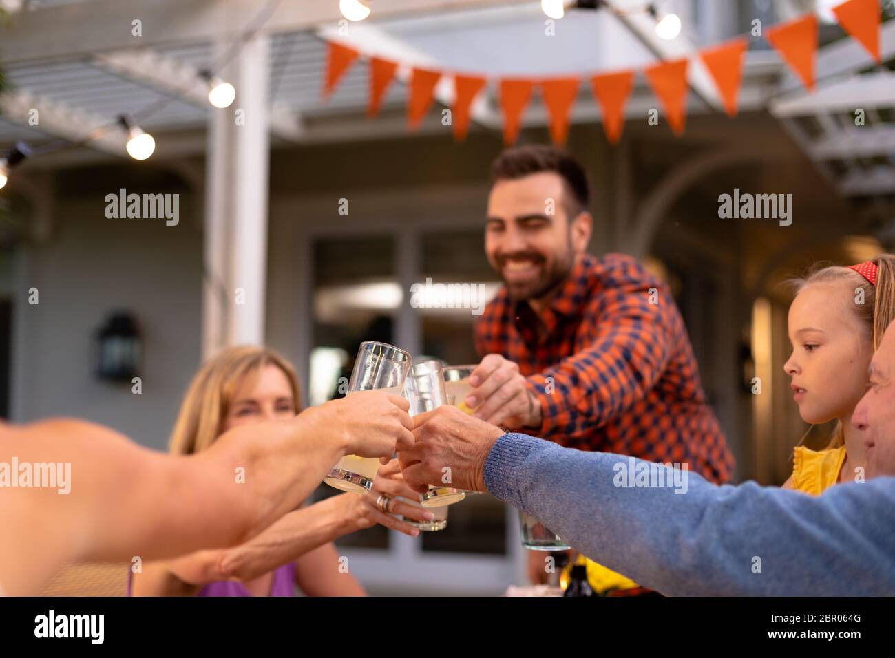 Happy Caucasian family eating together at table Stock Photo