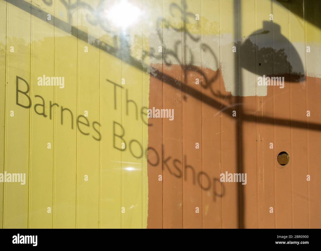Shadows in the window of the former and now empty Barnes Bookshop, Barnes, London, SW13, UK Stock Photo