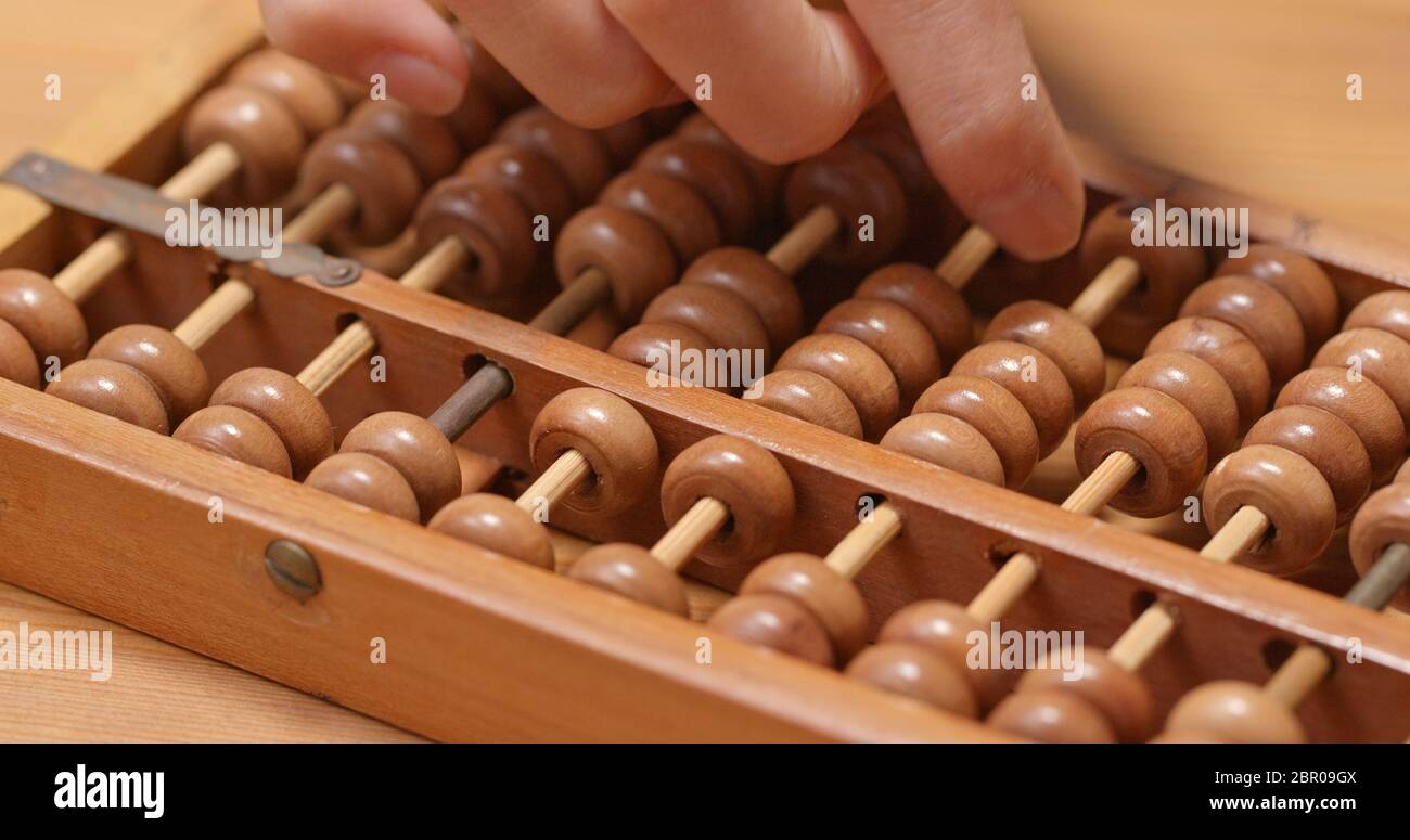 Calculate on abacus Stock Photo