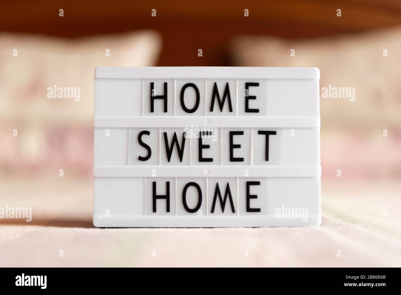 Lightbox with text: home sweet home on bed, copy space Stock Photo - Alamy