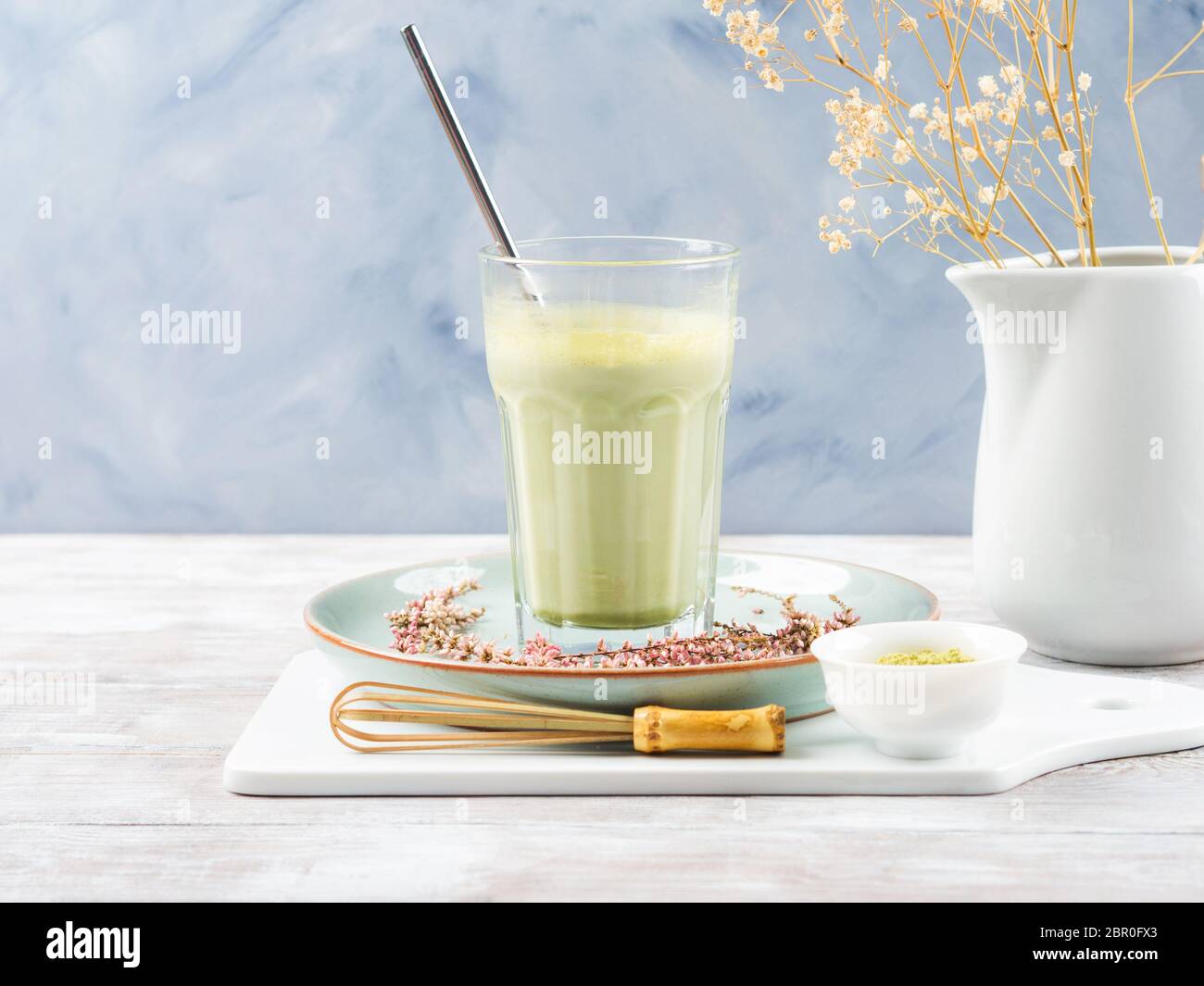 Green matcha tea latte drink in tall glass Stock Photo Alamy
