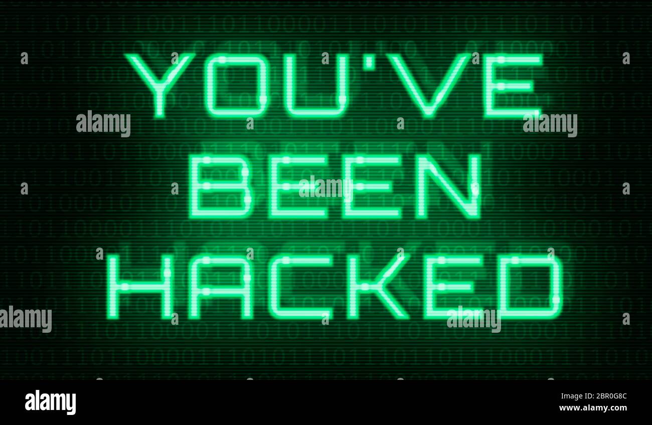 Binary code with the words You have been hacked Stock Photo