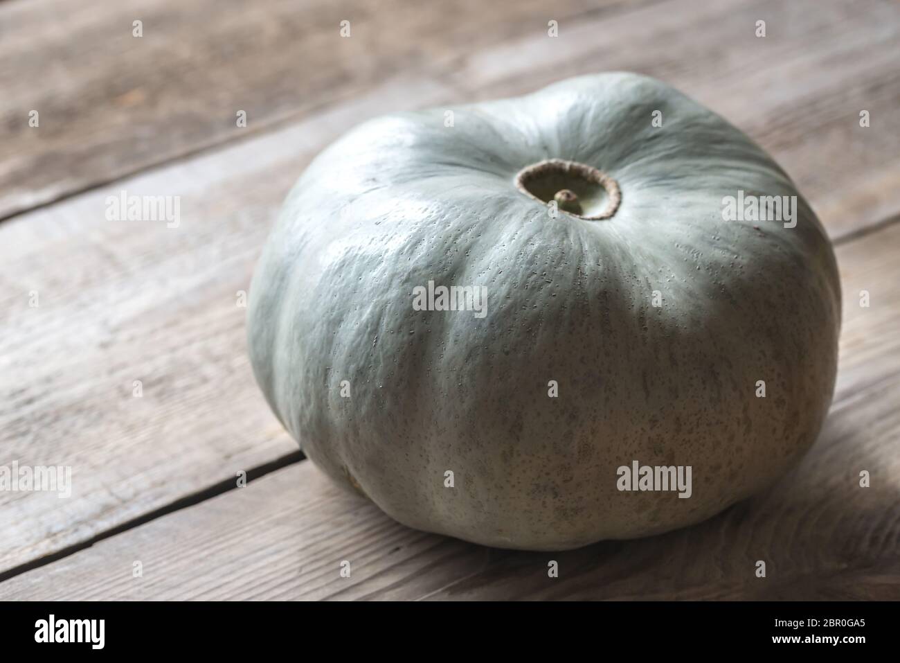 Ripe pumpkin on the wooden background Stock Photo - Alamy