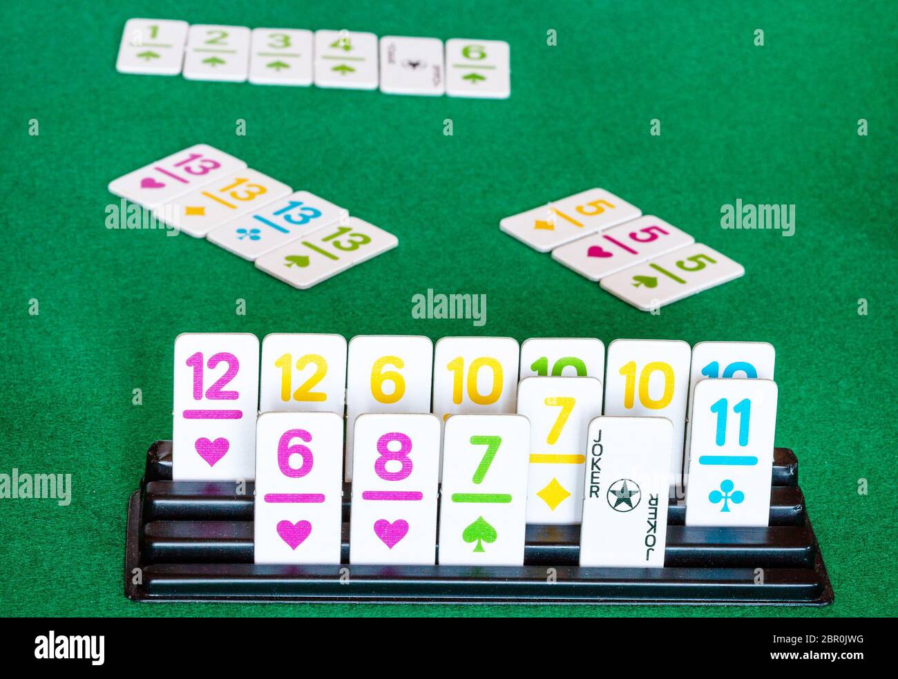 tiles in rack and board during playing in Rummy tilebased card game on