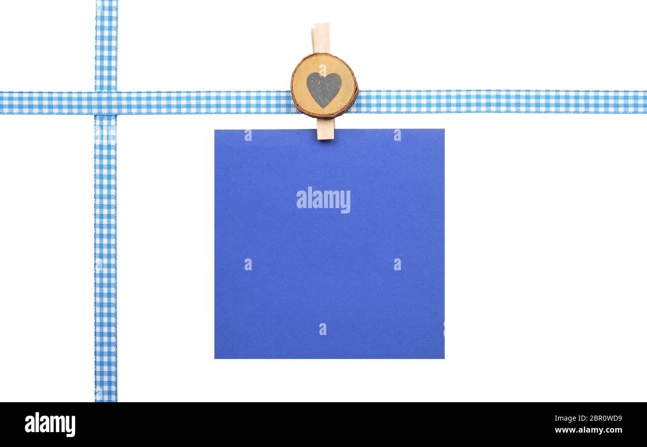 Checked ribbon and paper on white background Stock Photo