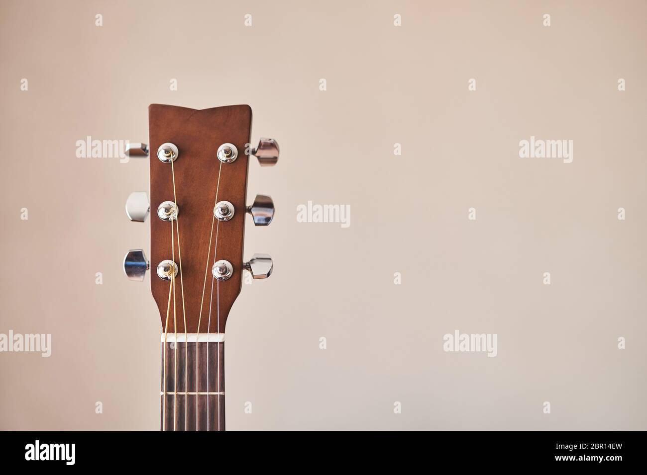 Acoustic guitar headboard with pegs. Guitar fretboard.  Stock Photo