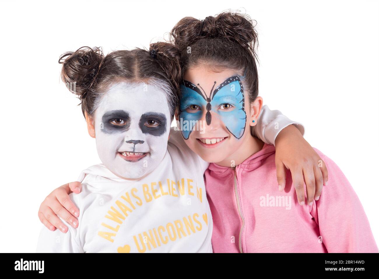 beautiful little girl with a painted fox on her face. face painting Stock  Photo