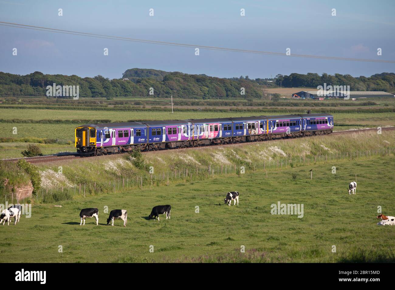 3 Northern rail sprinter trains forming a Manchester to Blackpool evening commuter train on the line to Blackpool Stock Photo