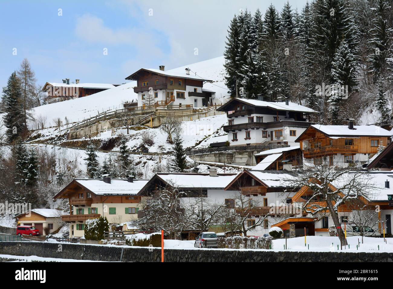 Austria, homes in traditional Tyrolean style in Fieberbrunn Stock Photo