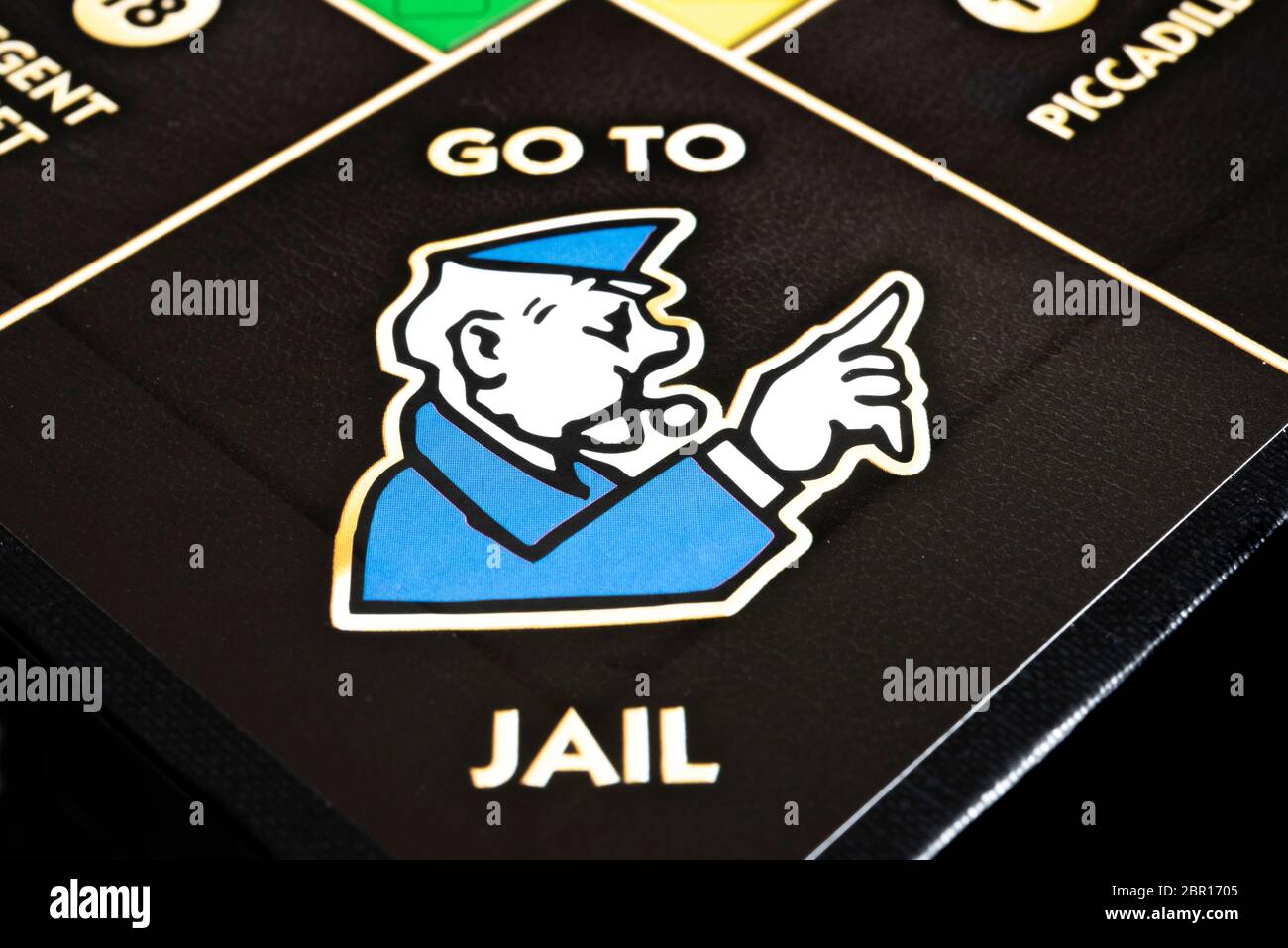 Monopoly go to jail policeman blowing whistle Stock Photo