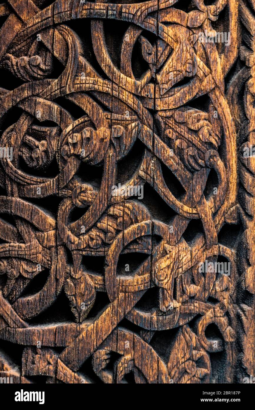 Ornaments of ancient vikings on a wooden surface. External wooden wall  carved decoration of medieval Stave church with viking motifs covered with  tar Stock Photo - Alamy