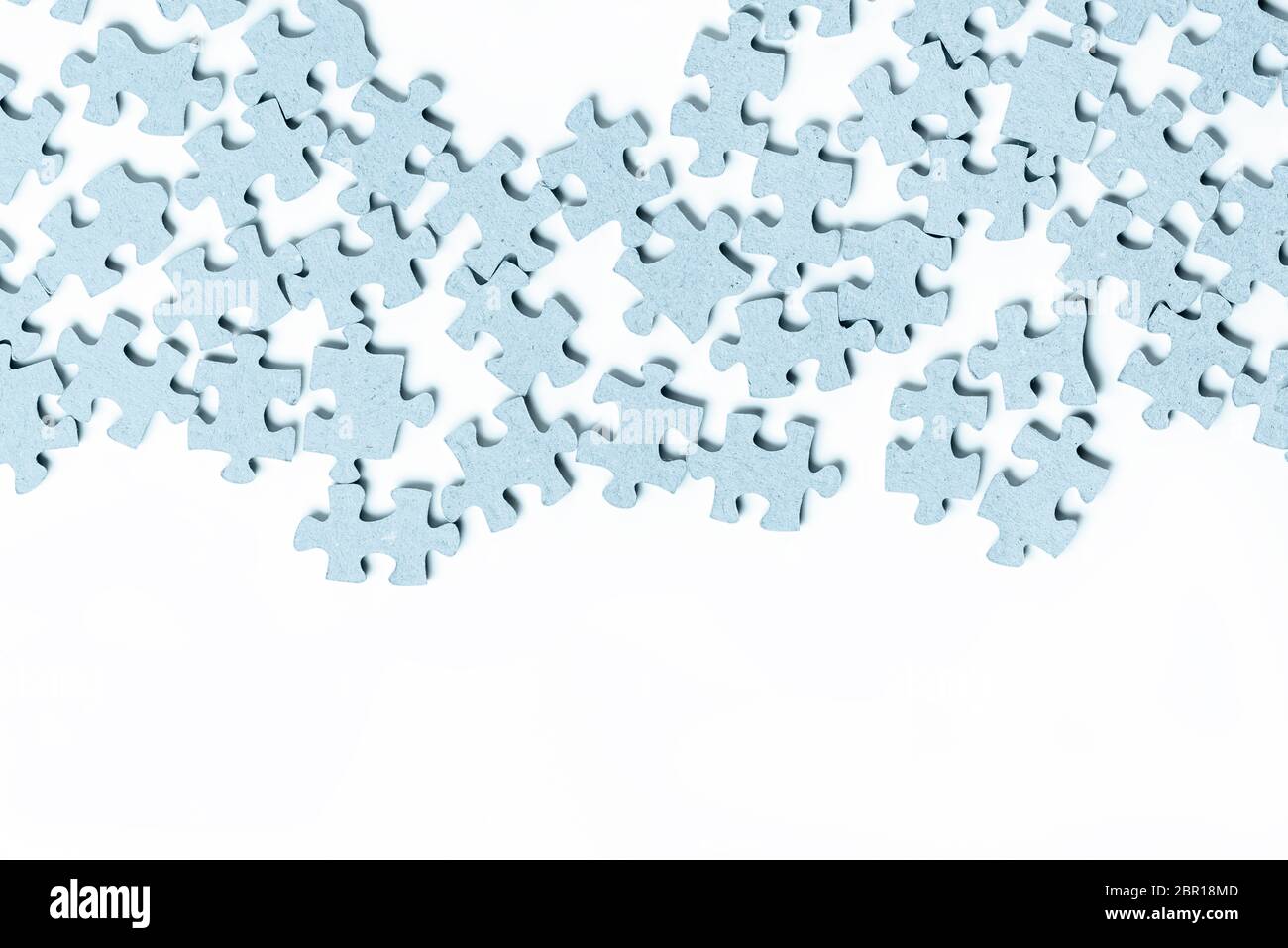 Light blue texture puzzle pieces separate white background Stock Photo