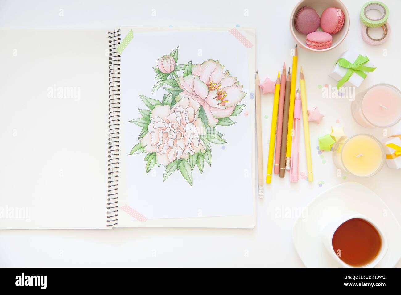 sketch drawing with colored pencils. flowers peonies. Candles, gifts, tea and white background Stock Photo