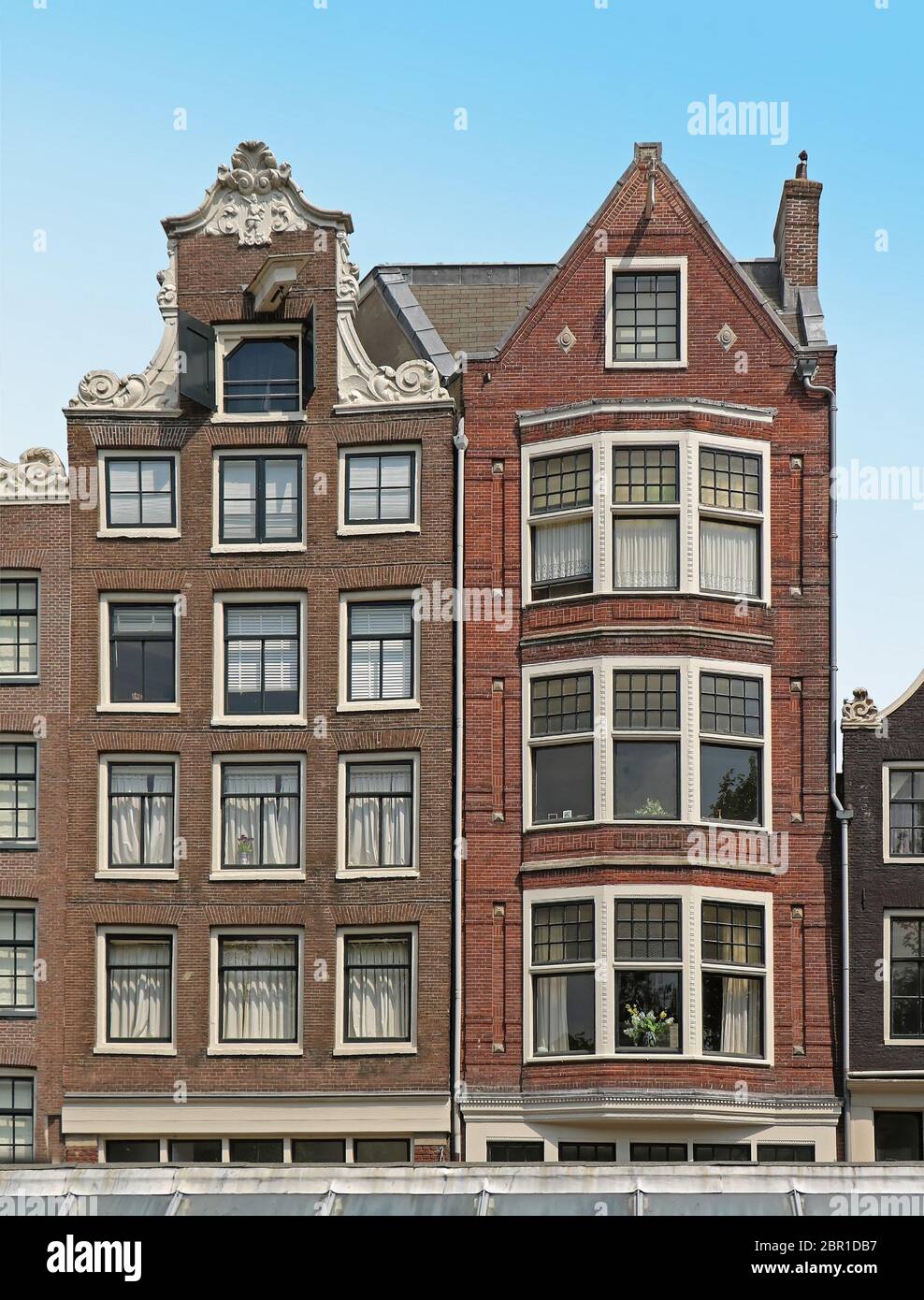 Traditional Dutch architecture house facade with tall windows in Amsterdam Stock Photo