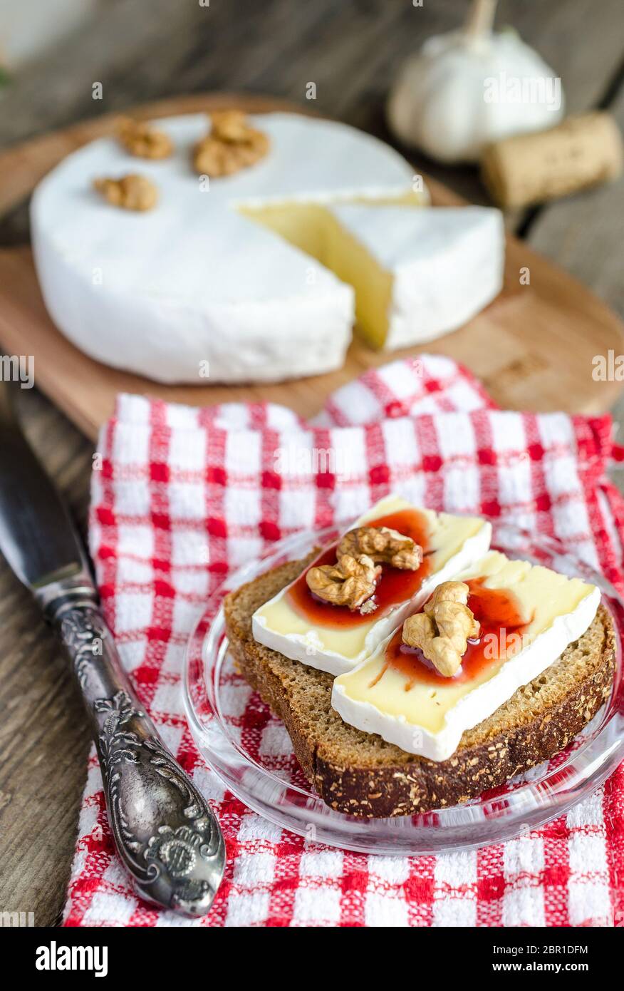Sliced camembert on the bread Stock Photo