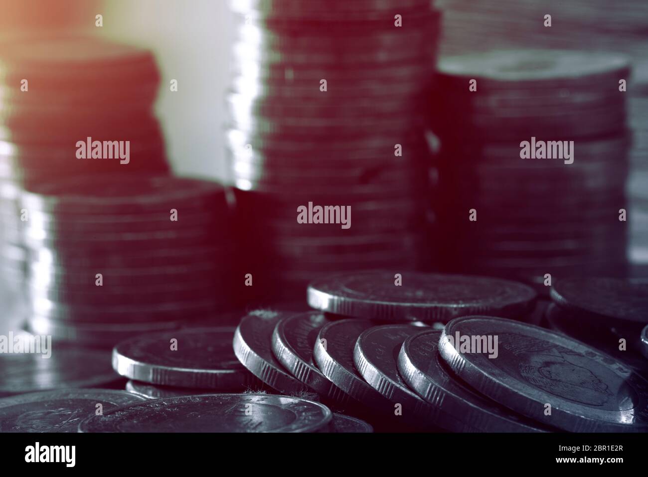 Close up of coins to stack of coins, Business Growth concept, There is money coins to stack of coins. Financial risk. Stock Photo