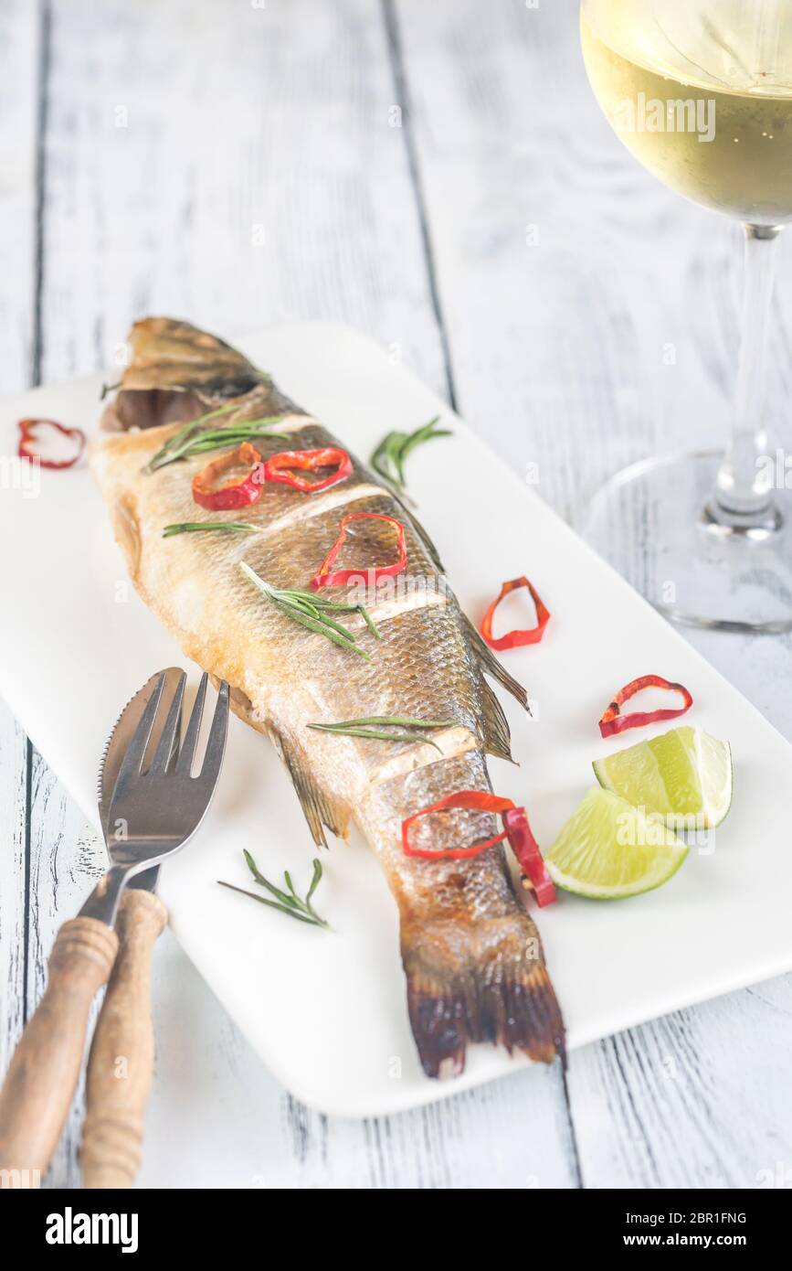 Baked sea bass with lime and chilli pepper Stock Photo Alamy