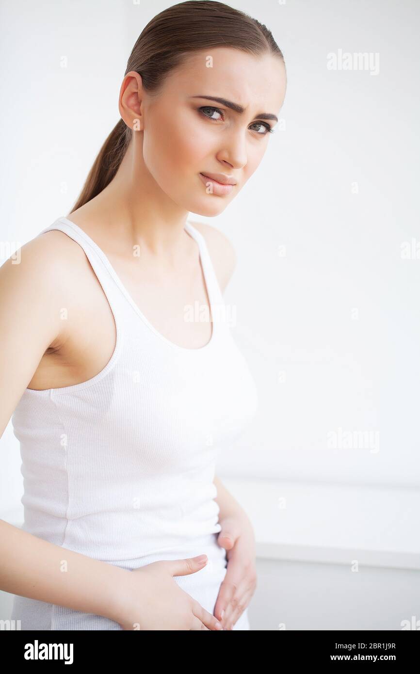 Stomach pain. Woman having painful stomachache,Female suffering from