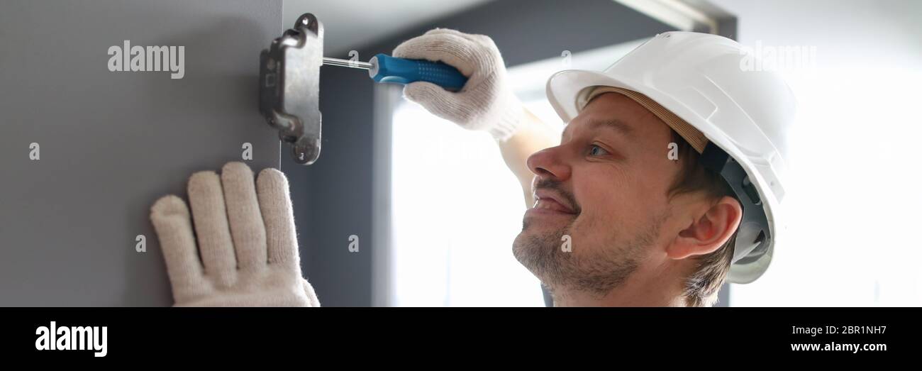 Cheerful male in white helmet Stock Photo