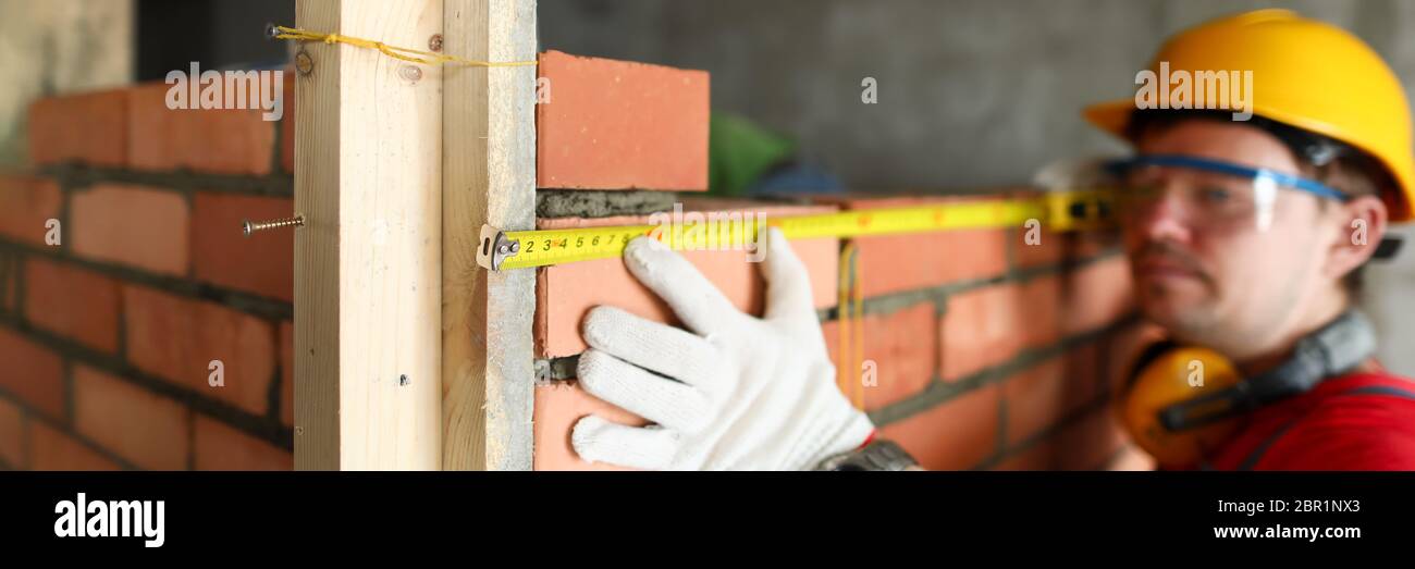 Builder using special tools Stock Photo