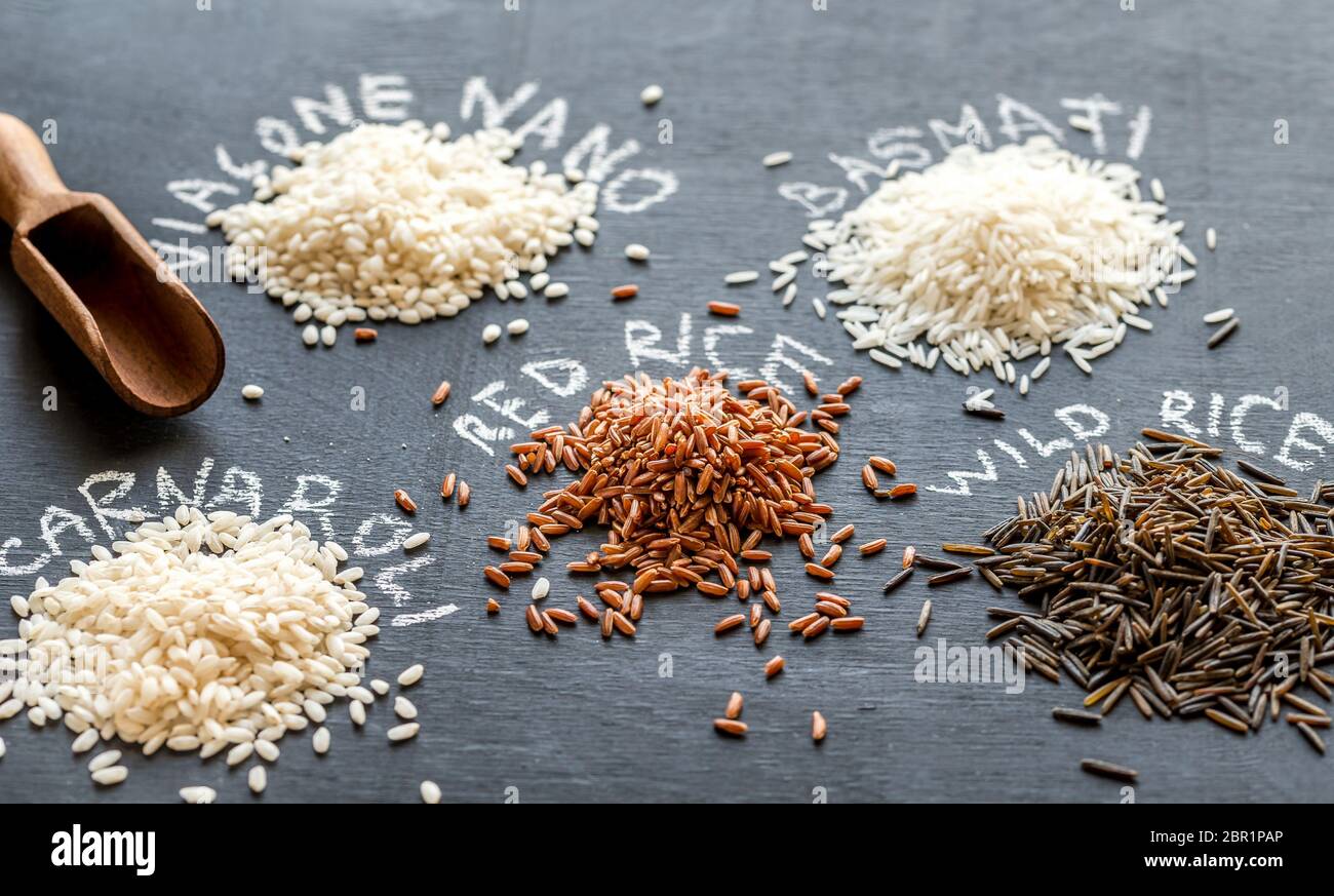 Different kinds of rice on the dark background Stock Photo - Alamy