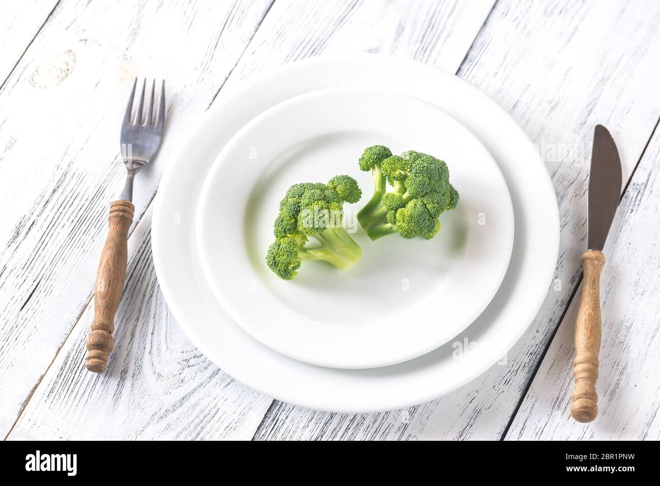 Fresh broccoli on the white plate Stock Photo