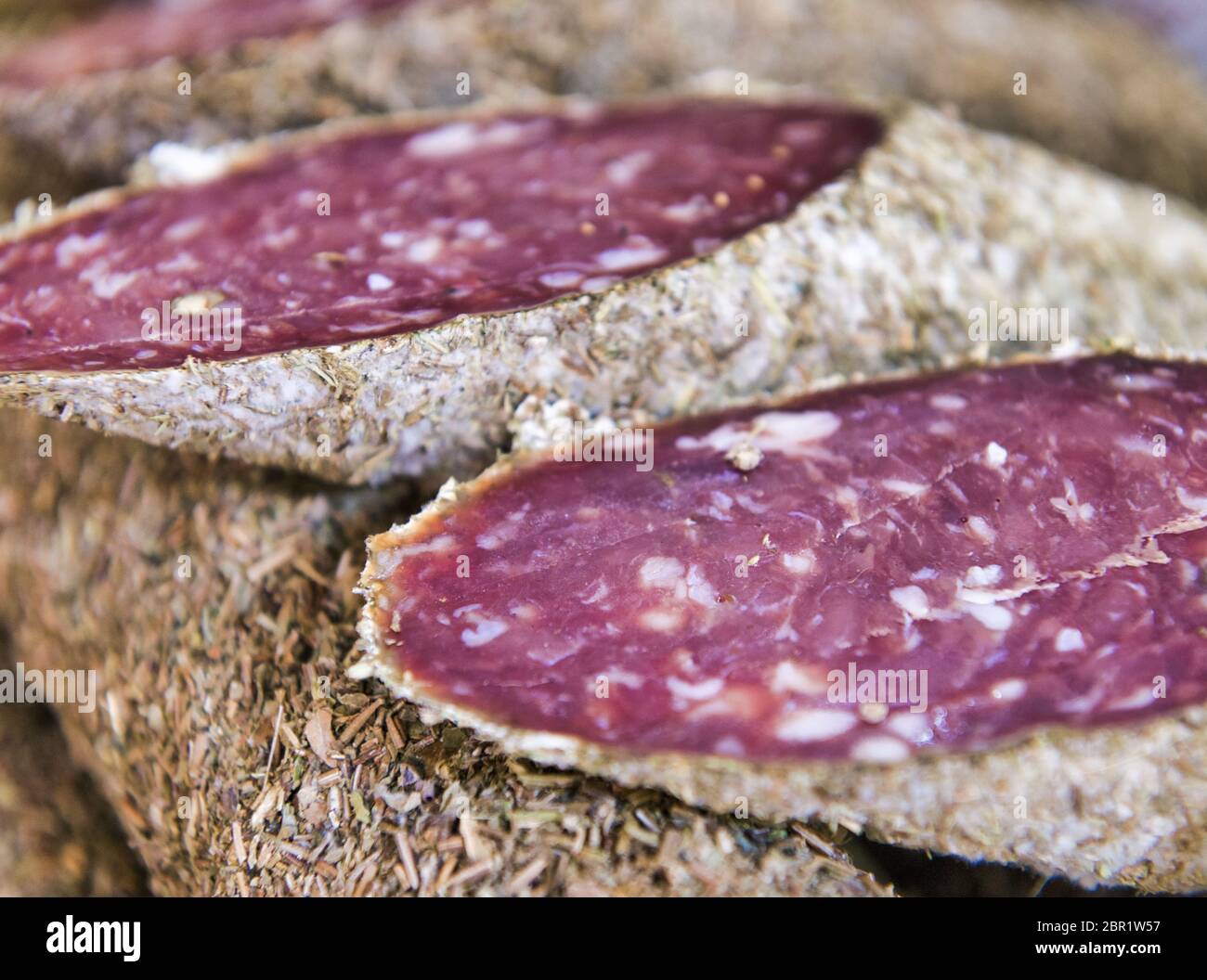 Tuscan sausage on the table. Fresh Salami. Stock Photo