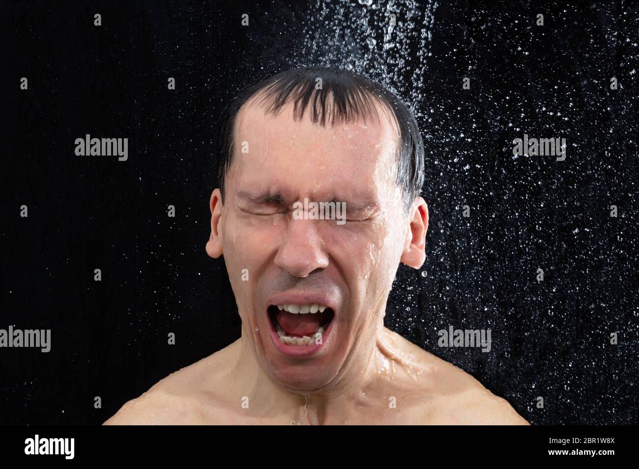 Portrait Of Young Man Taking Cold Shower In Bathroom Stock Photo Alamy