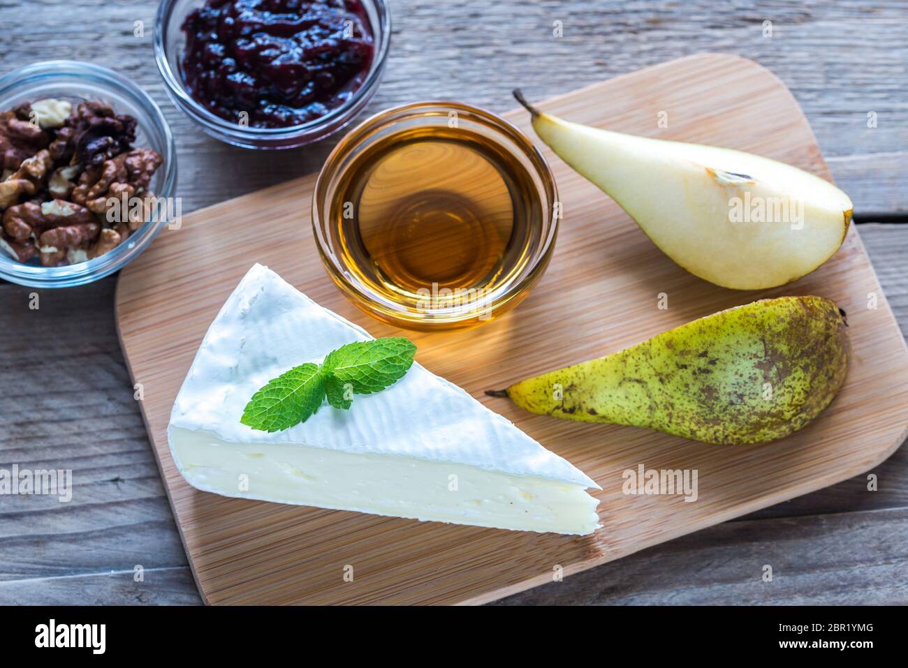 Brie cheese with honey, jam and nuts Stock Photo Alamy
