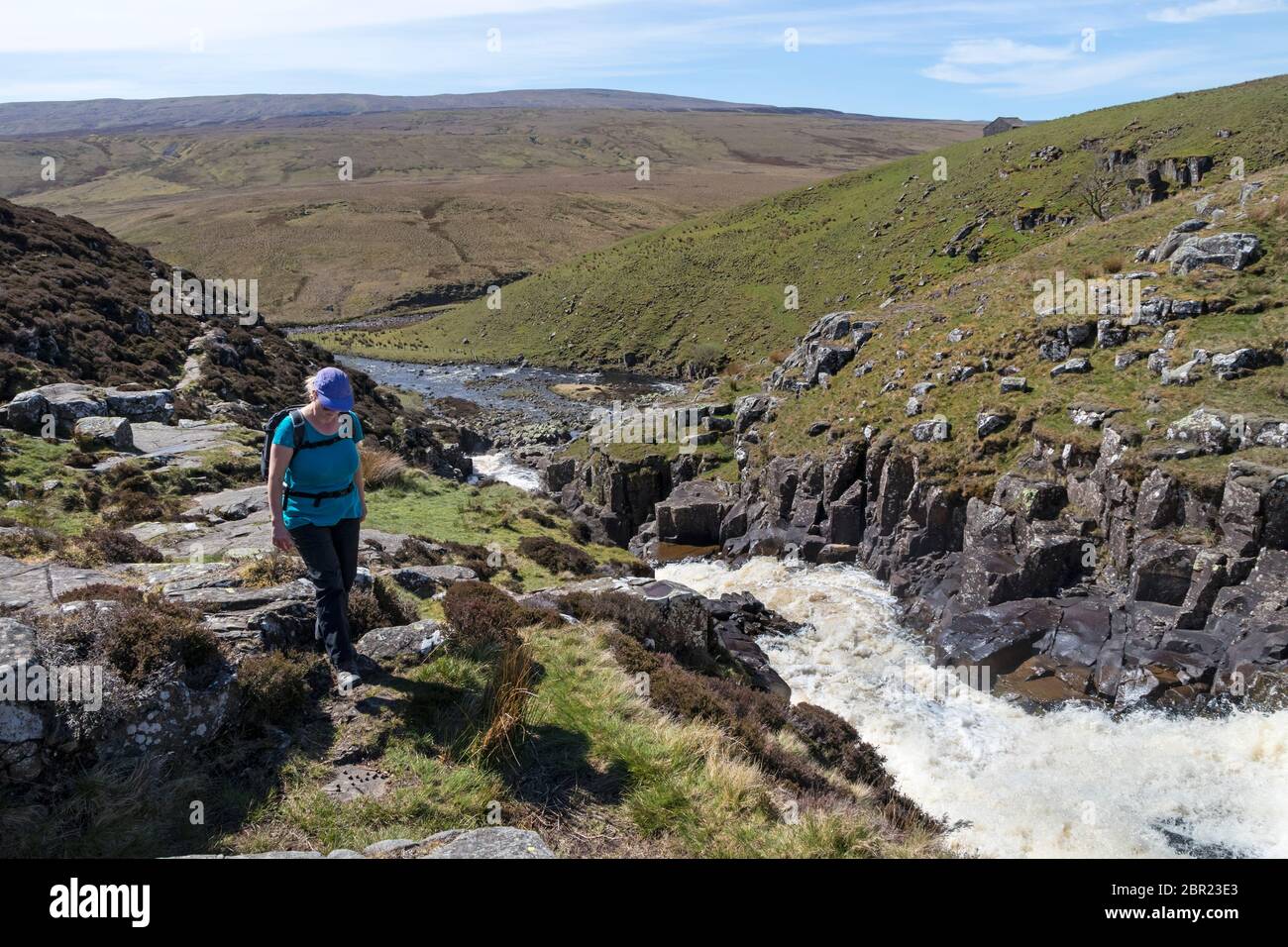 Walker on the Pennine Way at Cauldron Snout, Upper Teesdale, County Durham, UK Stock Photo