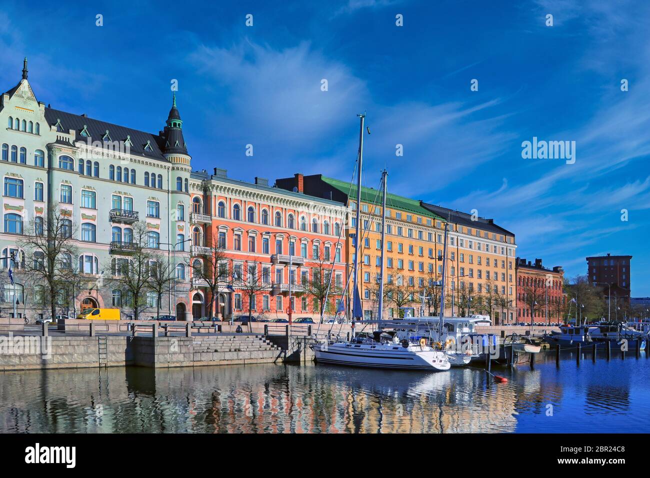 Pohjoisranta embankment with buildings of art nouveau and other historic architectural styles, and with moored recreational boats. Helsinki, Finland. Stock Photo