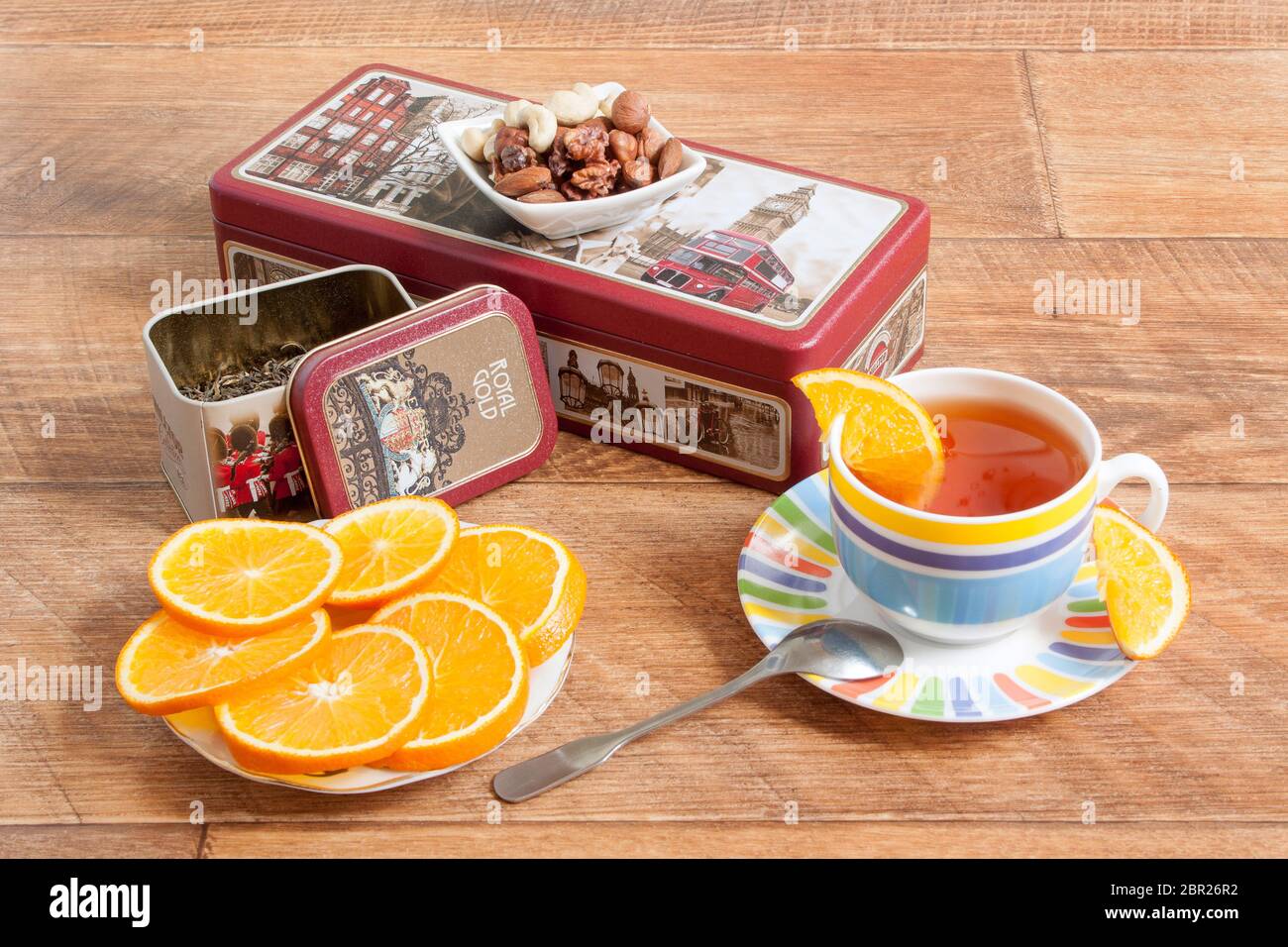 Russia, Izhevsk - May 15, 2017:Tea set Hilltop. Ceylon black and Chinese green tea. Fresh orange and nuts. Box Walking through London. Stock Photo