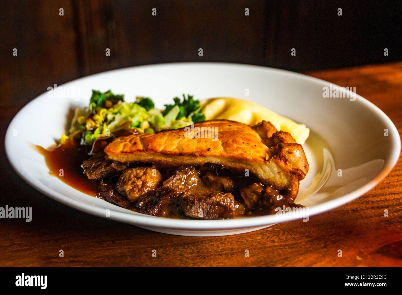 A steak and mushroom pie at the High Corner Inn at Linwood in the New Forest. Stock Photo