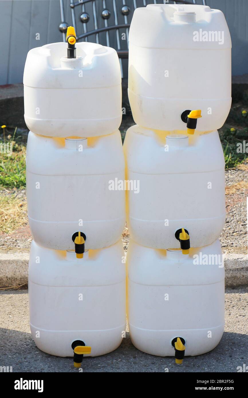 Empty plastic jugs pile ready to be filled with water for emergency