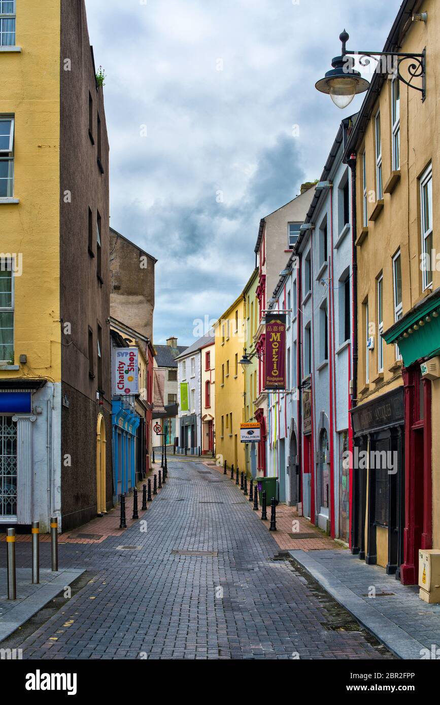 View of colourful street including cafes and shops in Waterford, County Cork, Ireland Stock Photo