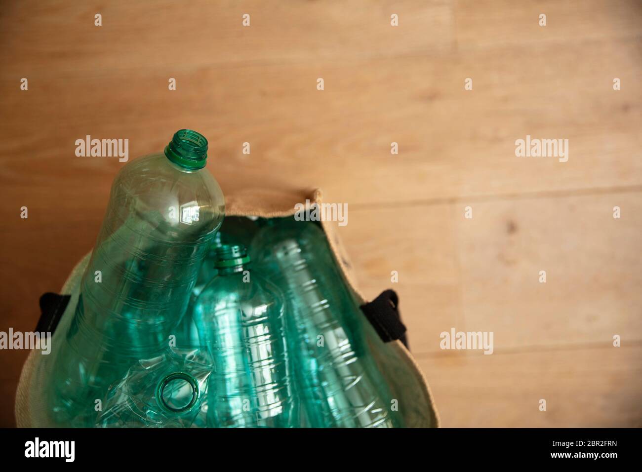 A collection of used green plastic bottles ready to be recycled Stock