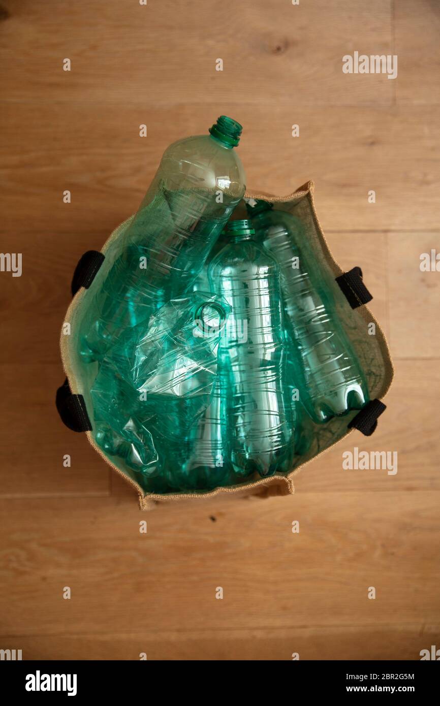 A collection of used green plastic bottles ready to be recycled Stock Photo