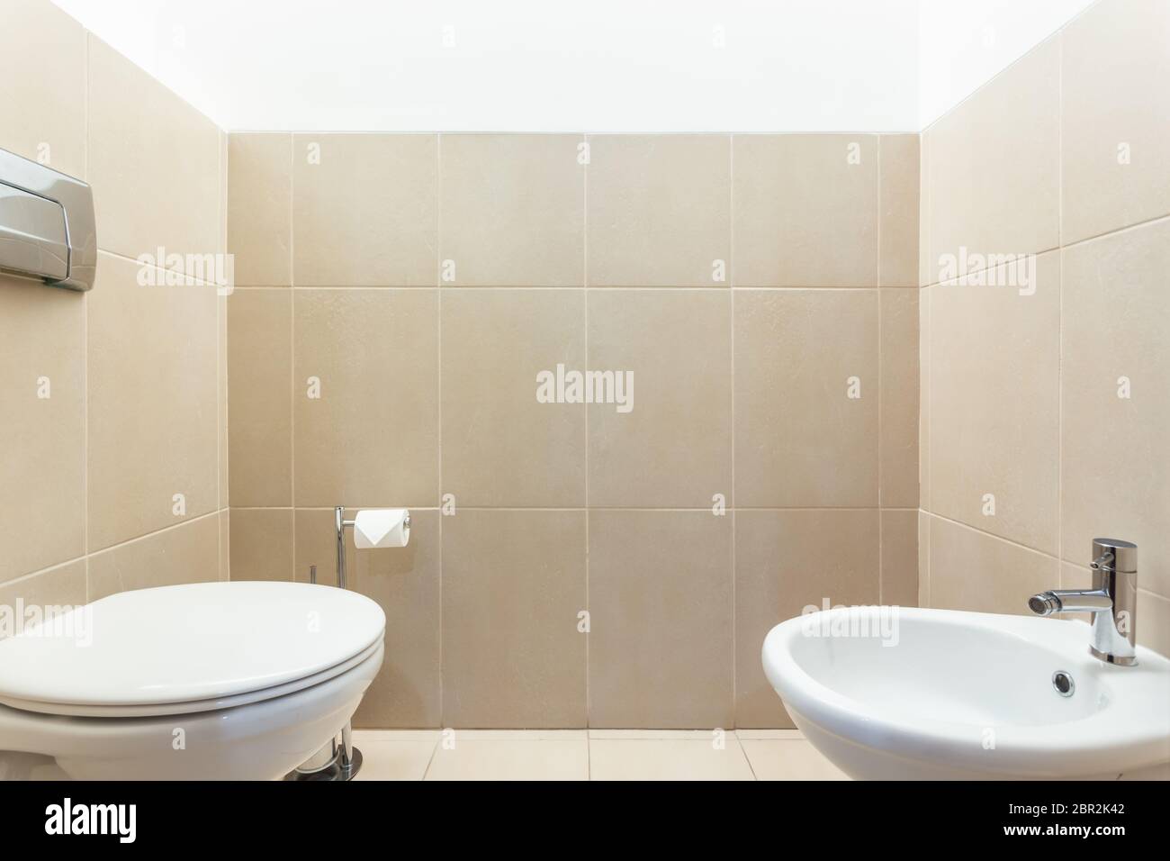 Modern bathroom with toilets bowl. European hotel design Stock Photo Alamy