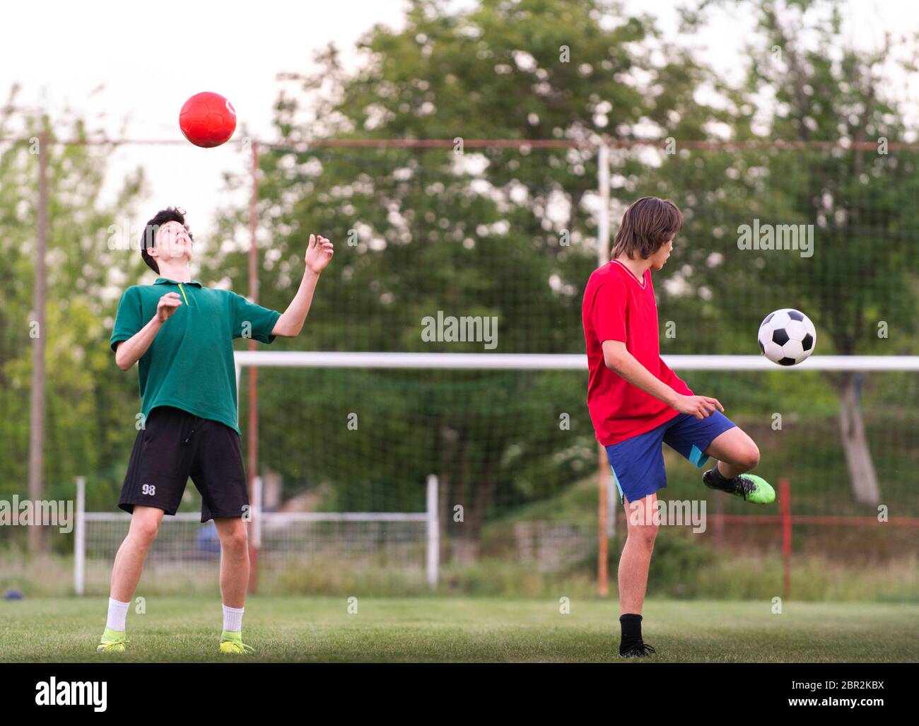 Soccer team practicing on football ground. Stock Photo