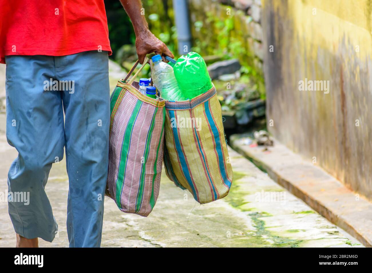 Plastic bottle are carrying out for recycling. Stop using plastic. Beat ...
