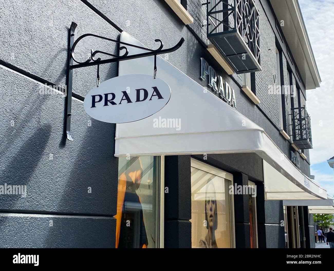Roermond, Netherlands - May 19. 2020: View on facade with logo lettering of  Prada fashion company at shop entrance Stock Photo - Alamy