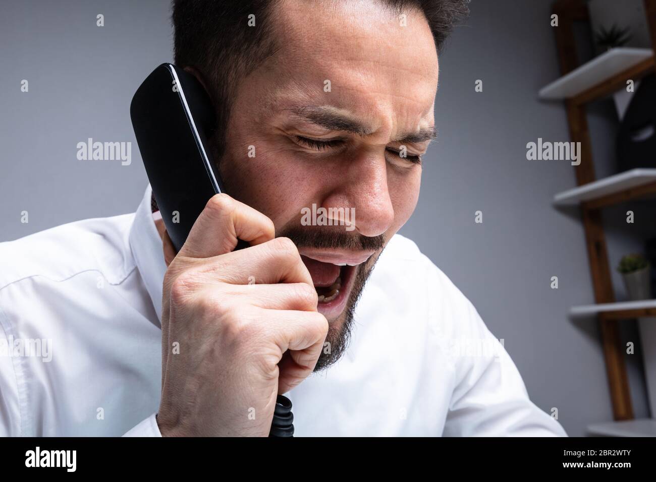 Angry man yelling at phone rage hi-res stock photography and images - Alamy