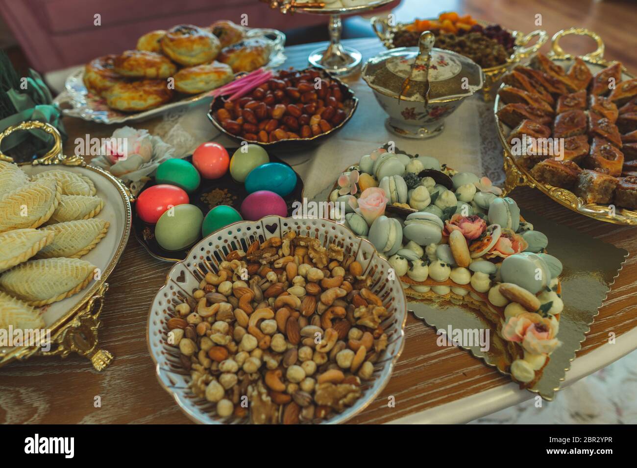 Traditional Azerbaijan holiday Nowruz cookies, baklava, other sweets on the table for celebration. Stock Photo