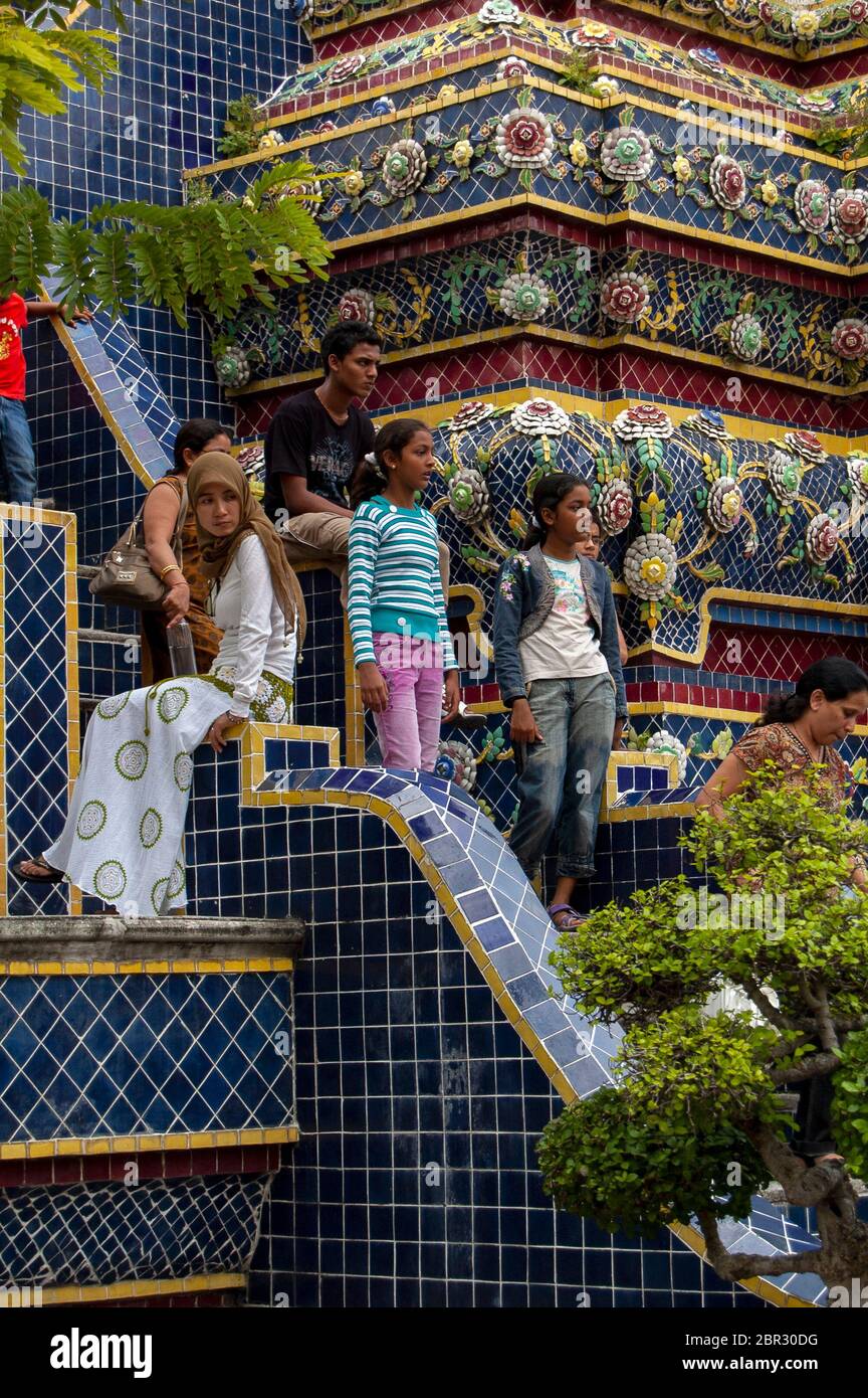Indian tourists visiting the Temple of the Reclining Buddha, in Bangkok. Stock Photo
