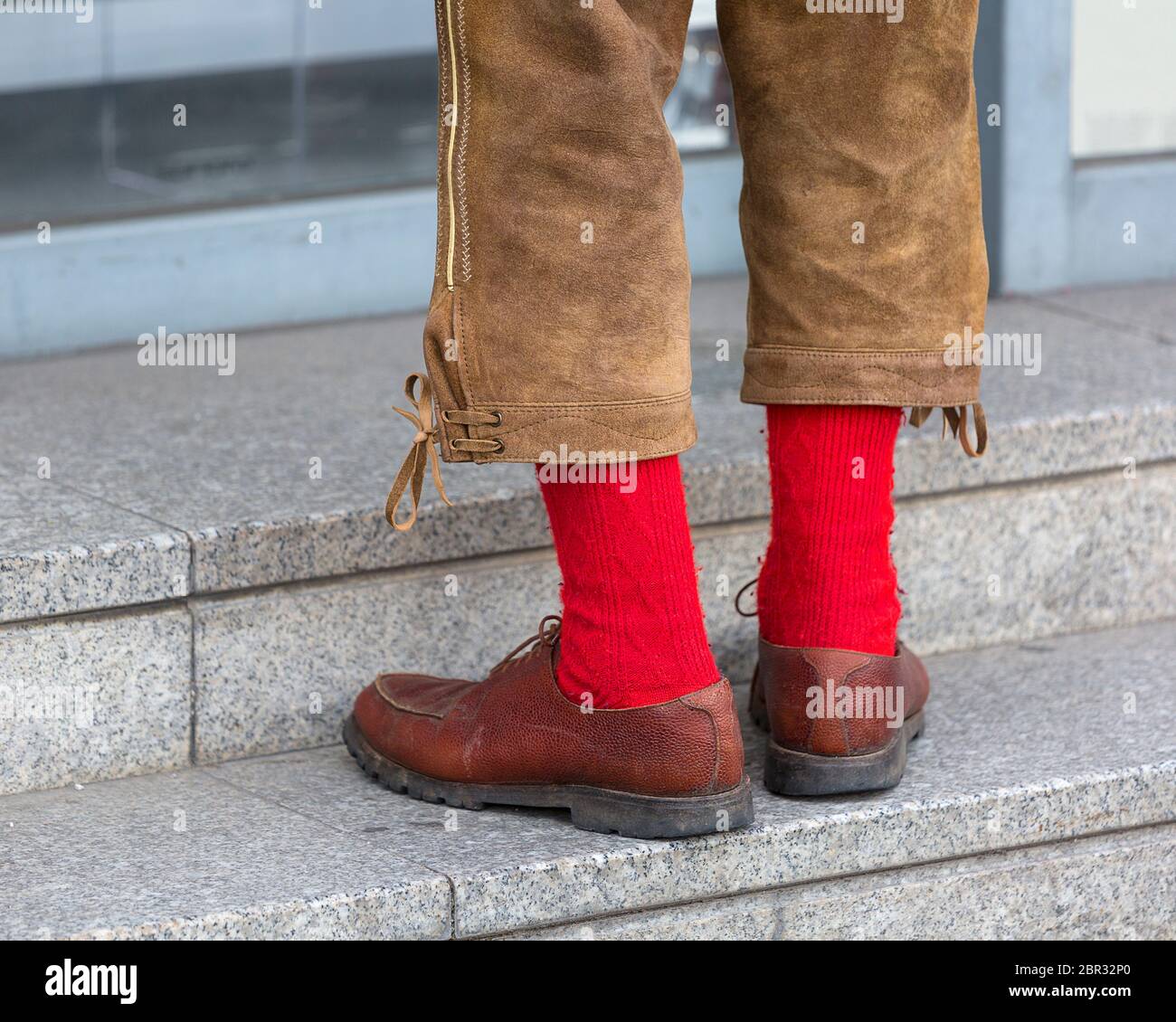 Man in traditional Bavarian leather trousers Lederhosen and red socks Stock  Photo - Alamy