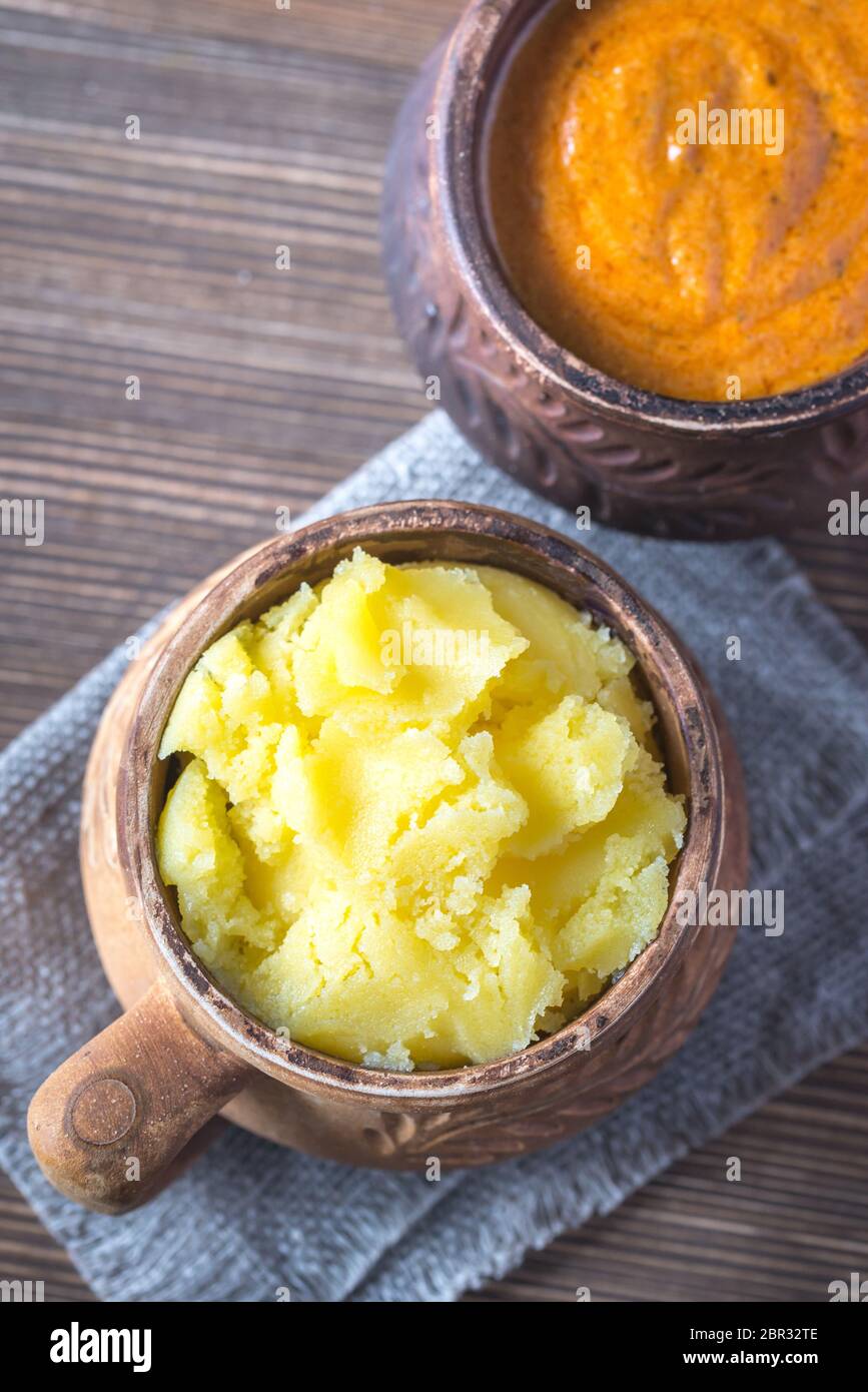 Bowls of ghee clarified butter and Indian butter sauce Stock Photo Alamy