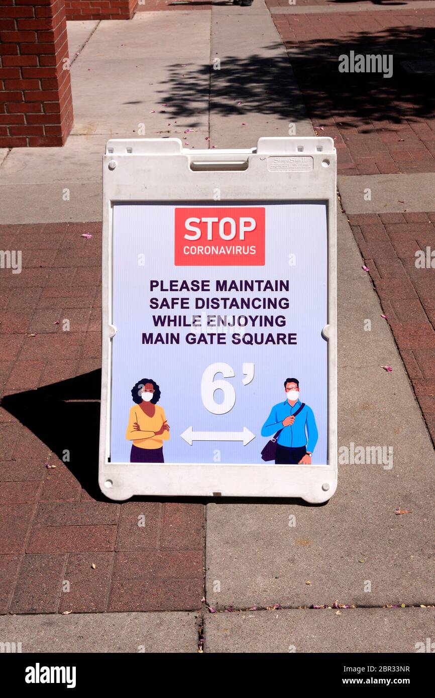 Social distancing reminder sign in downtown Tucson, AZ Stock Photo