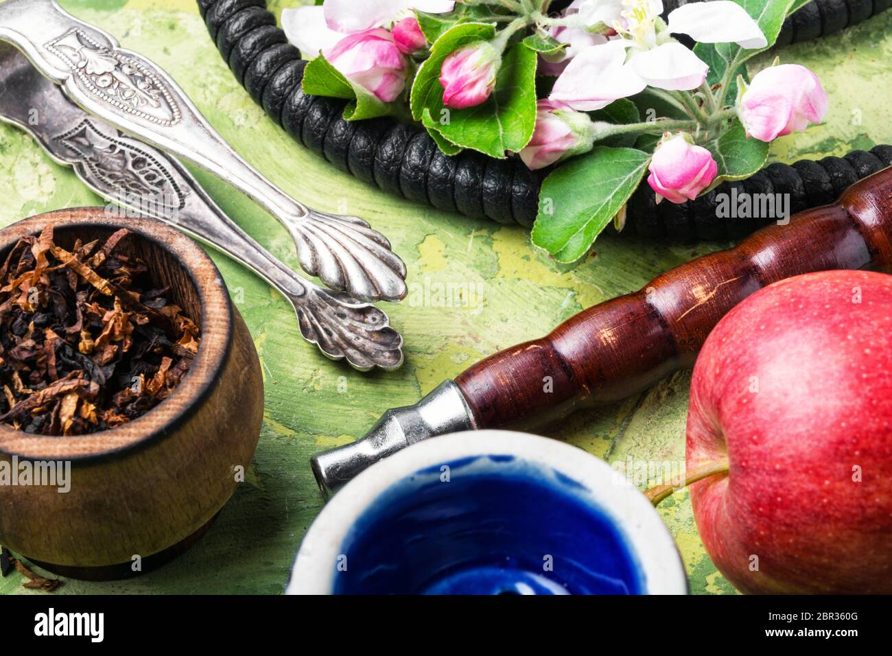 Oriental smoking hookah. Arabian shisha with apple. Hookah and apple